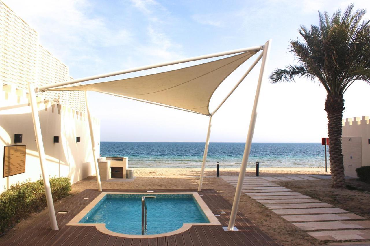 Sealine Beach, A Murwab Resort Mesaieed Exterior photo A shade sail over a swimming pool